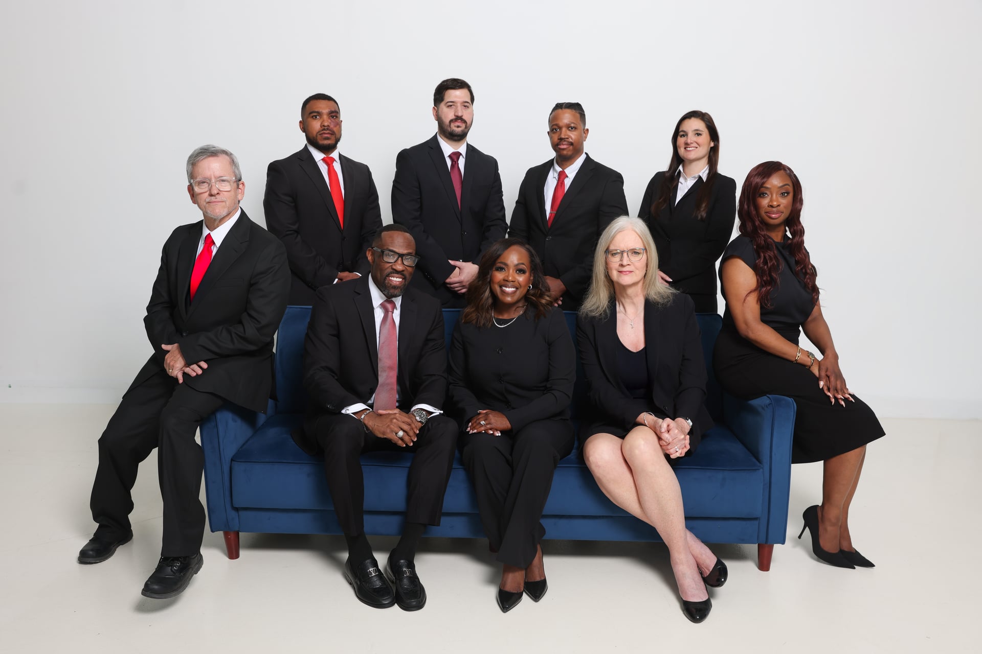 The L and L Law Group, PLLC criminal defense team — nine attorneys and staff including founders Njeri London and Reggie London at their Frisco, Texas office